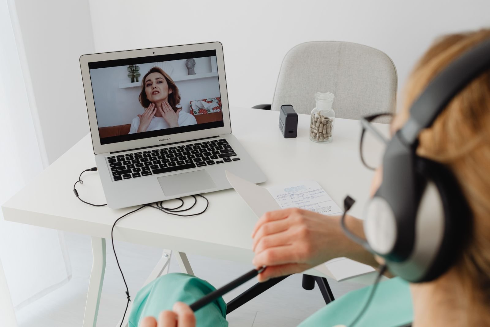 Healthcare professional on a telemedicine video call with a patient.
