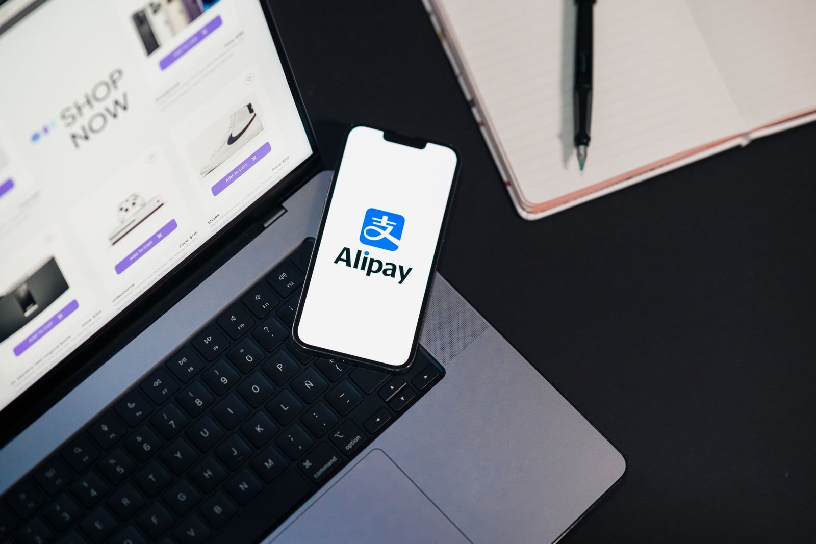 A smartphone and laptop showing a shopping app and web interface side by side.