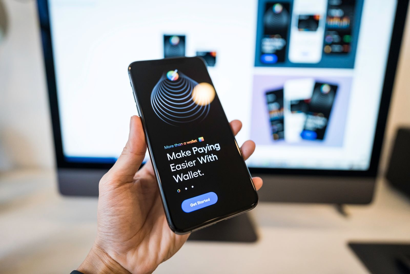 A hand holding a smartphone displaying a mobile app interface.