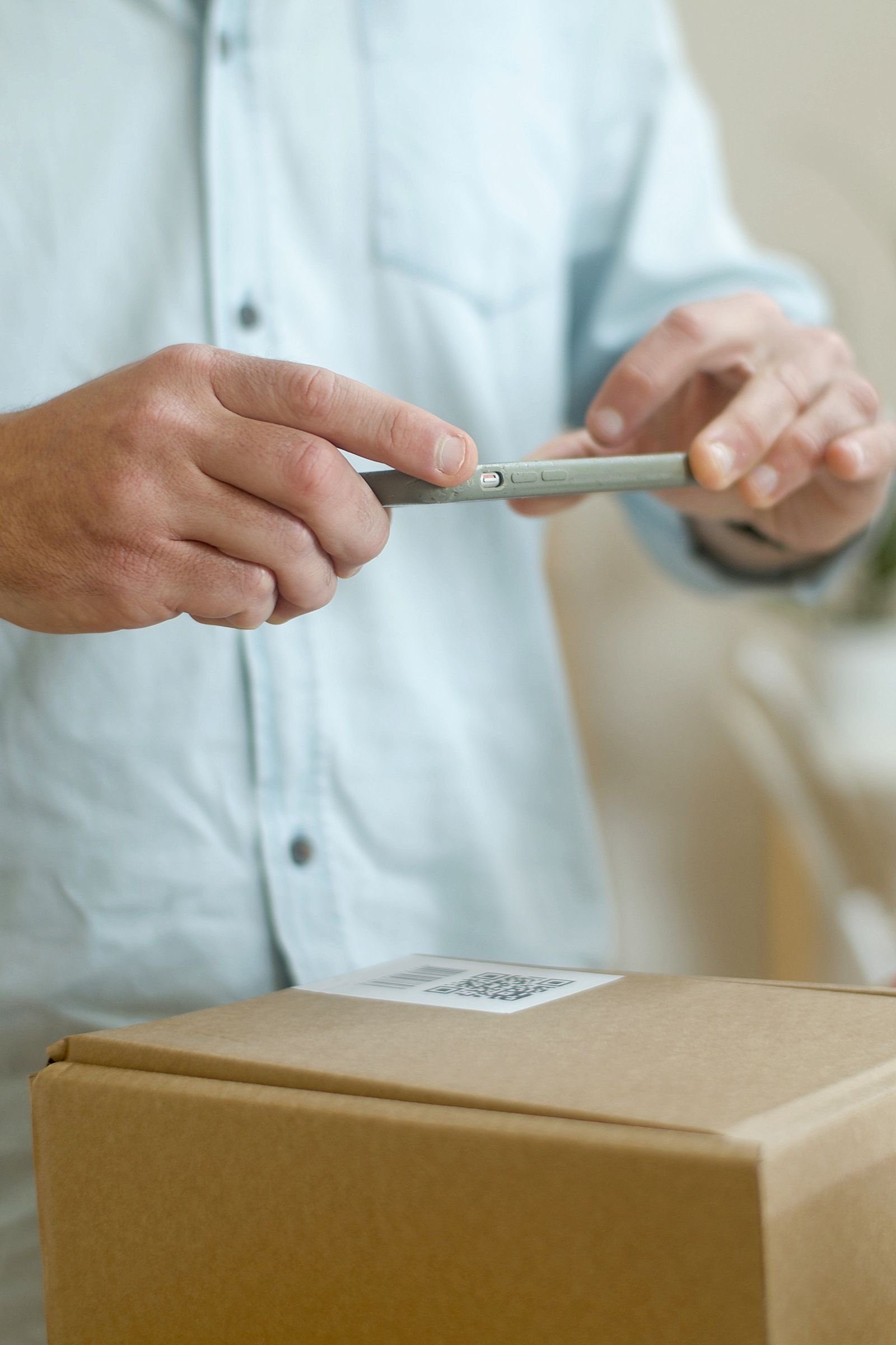 A QR code on a package being scanned as part of the pre-registration process.