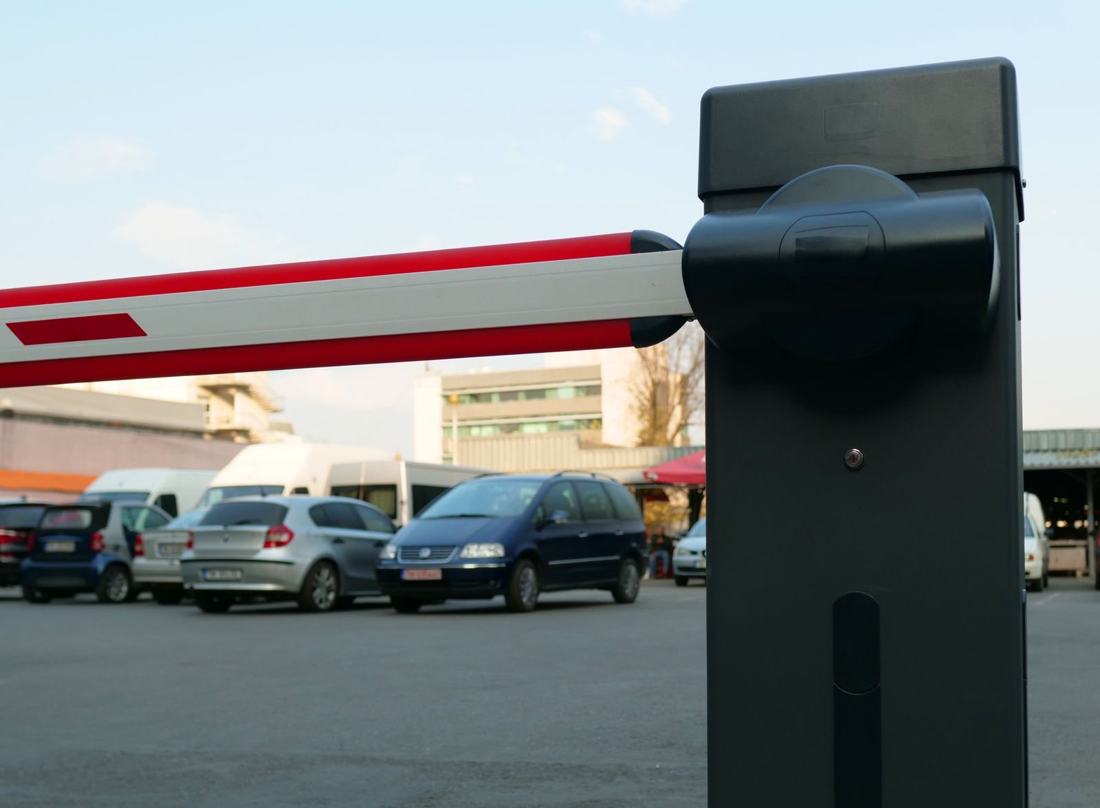 An automated boom barrier gate at a facility entrance.