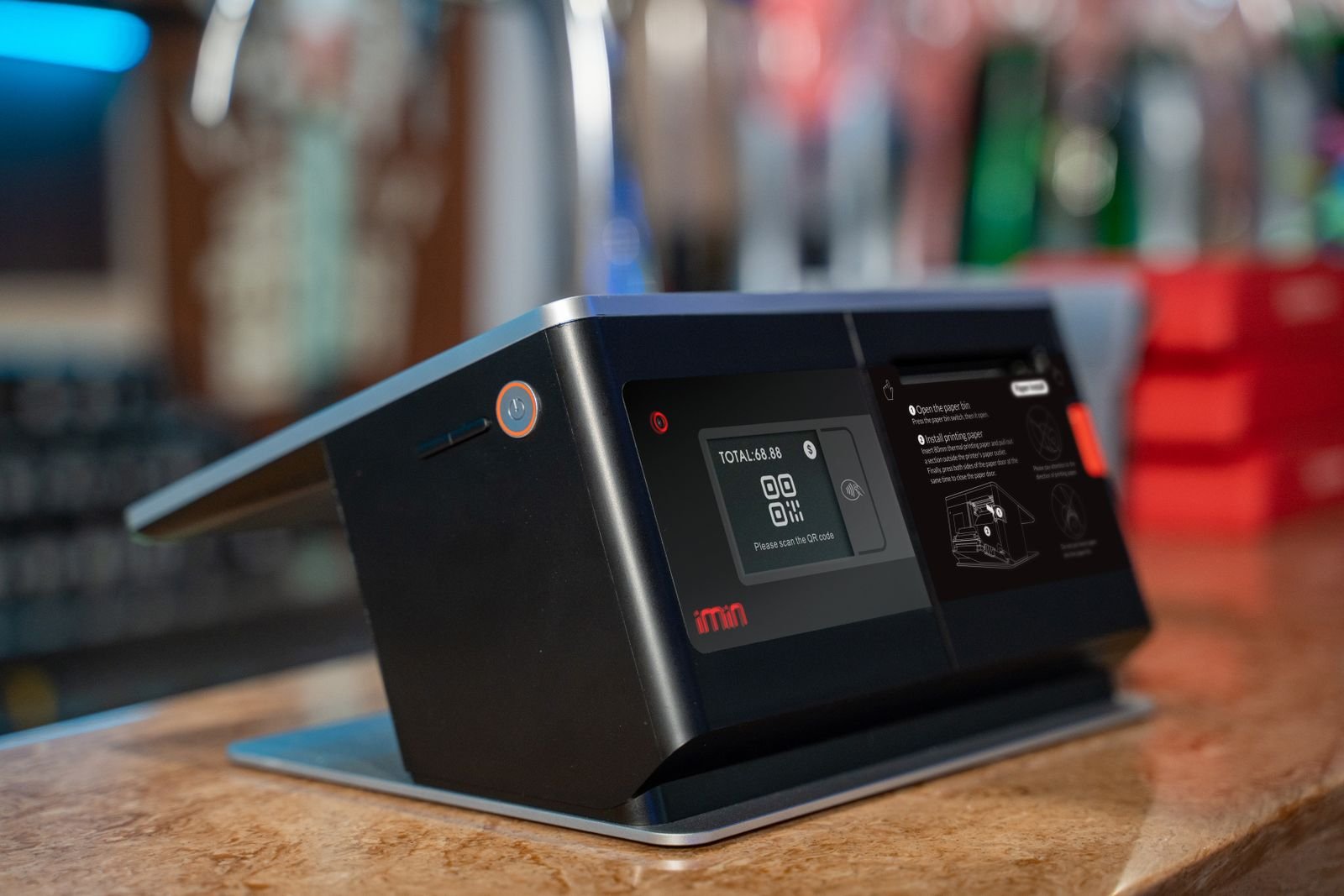 Barcode scanner and POS terminal on a store counter.